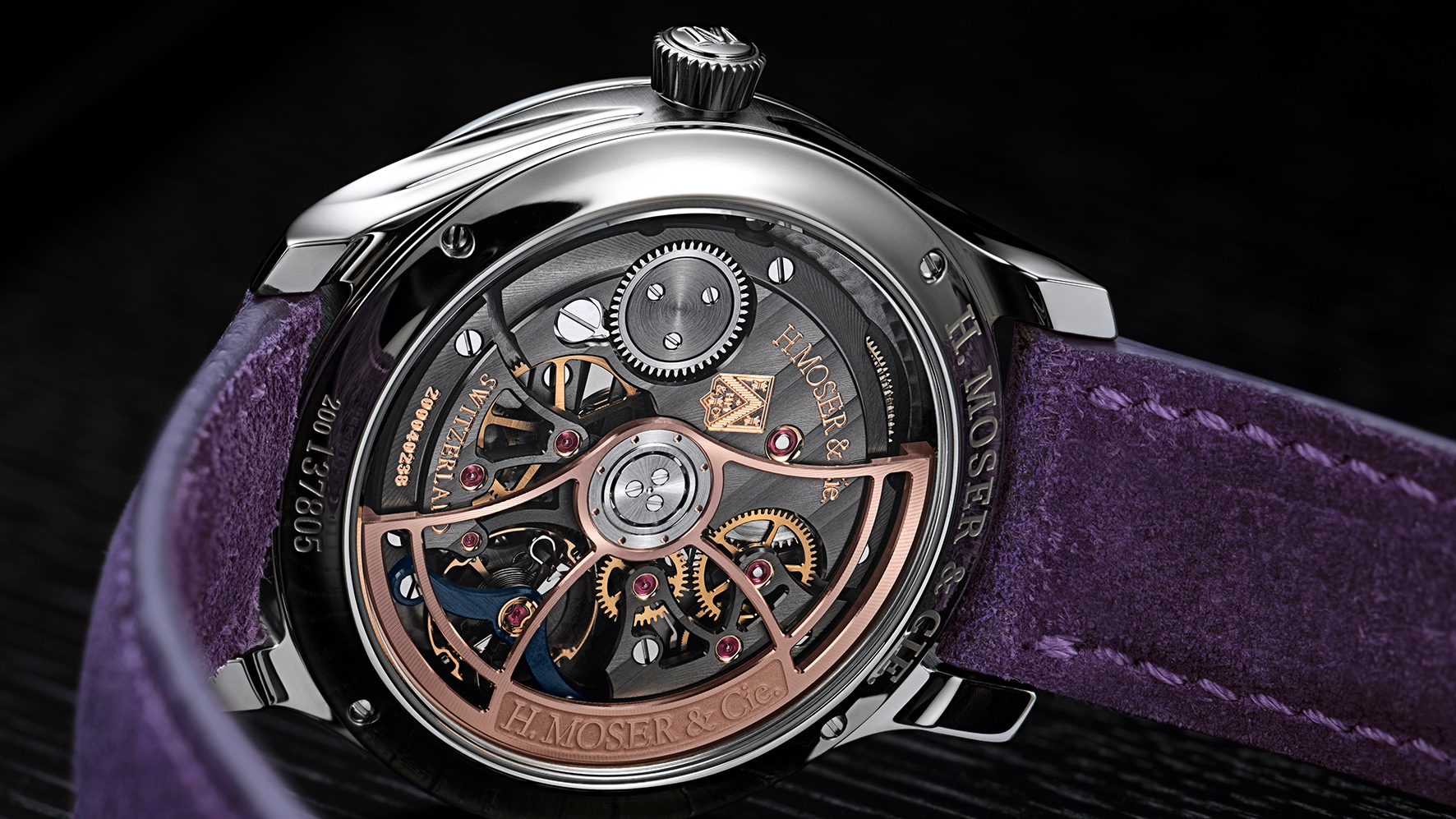 HMoser_1201-1200_Endeavour_CentreSeconds_ST_Purple_Enamel__Lifestyle_caseback_table.jpg
